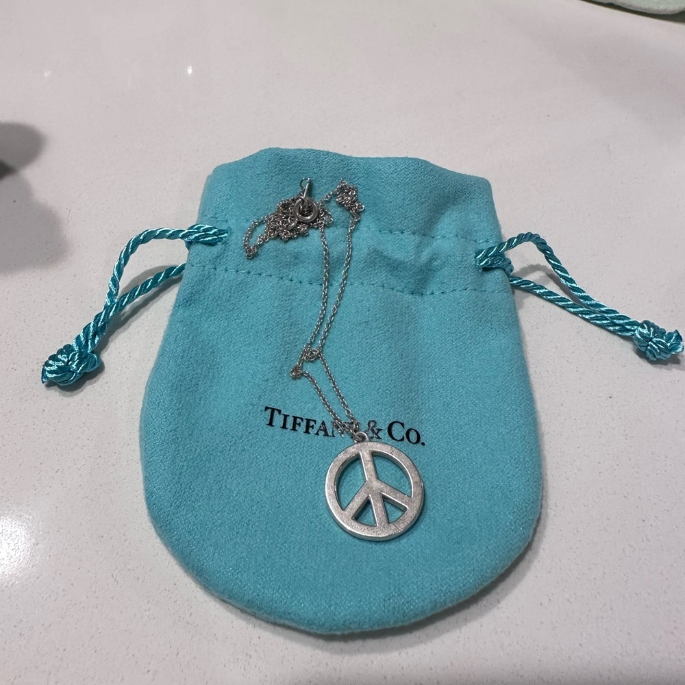 Tiffany and Co peace sign necklace